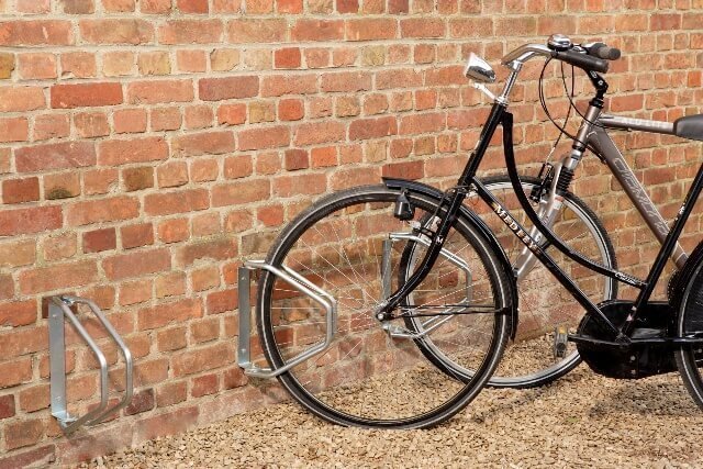 Wall-mounted, rotating racks for one bicycle