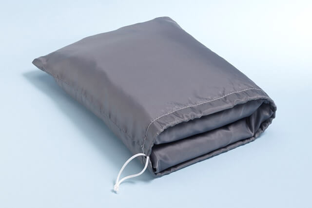 The curtain folds into a convenient bag