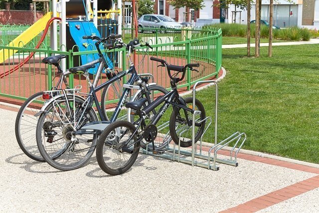 One-sided bike racks with protective hoops