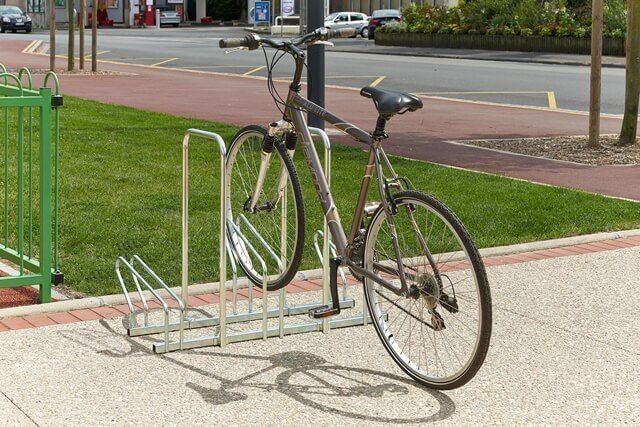 One-sided bike racks with protective hoops