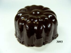 A small sponge cake covered in chocolate