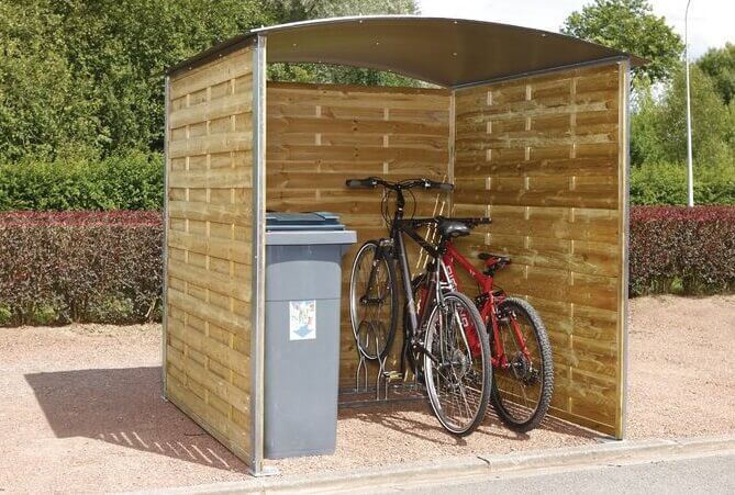 Closed wooden sheds for trash cans and bicycles