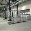 Galvanized steel racks for car repair shops, with upper crossbars adapted for placing body parts, soft coating