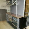 Shelving workbench with drawers, hanging shelf and hanging plastic containers