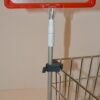 Holders for plastic frames are attached to the wire baskets