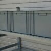 Reinforced crossbars with inserts for placing shelf covers