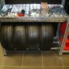 Adjustable depth shelf for tires
