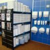 Shelves with blue perforated plastic shelf covers
