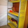 Racks with perforated plastic shelves and rack side covers