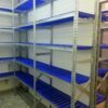 Racks with dark blue perforated plastic shelves
