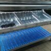 Shelving cart with blue perforated plastic shelf