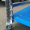 Sliding rack cart with perforated plastic shelf