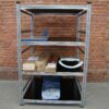 Racks with moisture-resistant stained plywood shelf covers