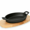 Oval cast iron pans for serving with wooden tables